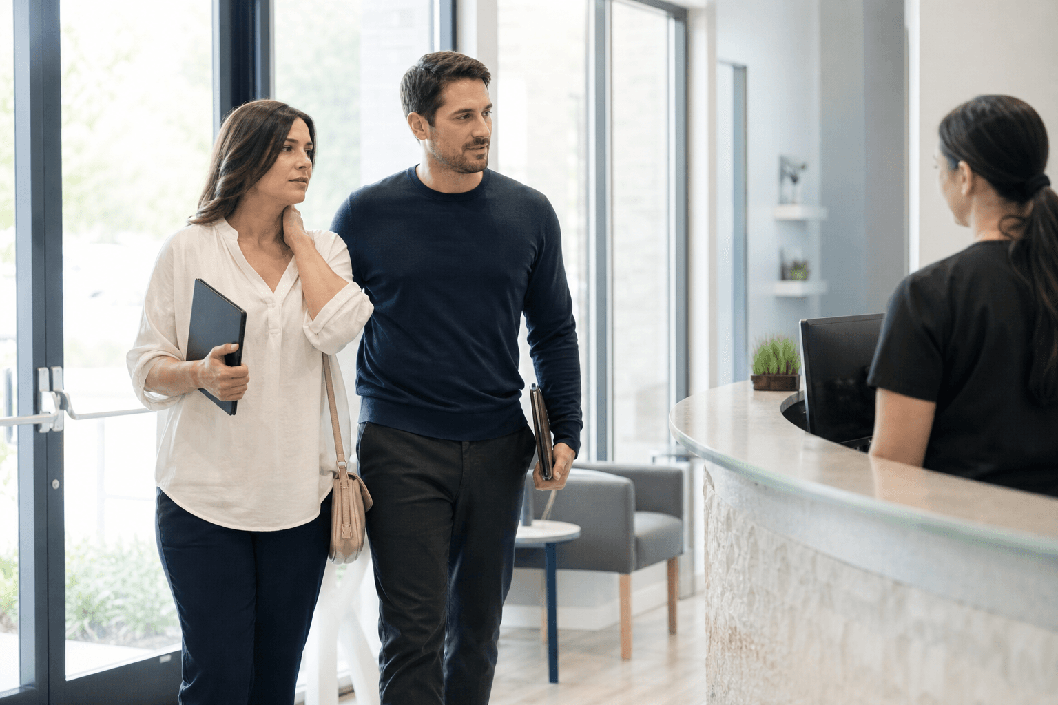 Patient arriving at a chiropractic clinic with a partner after a car accident injury